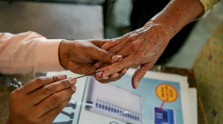 a-woman-in-morbi-presented-a-great-example-of-voting-awareness-by-reaching-out-to-vote-despite-being-ill