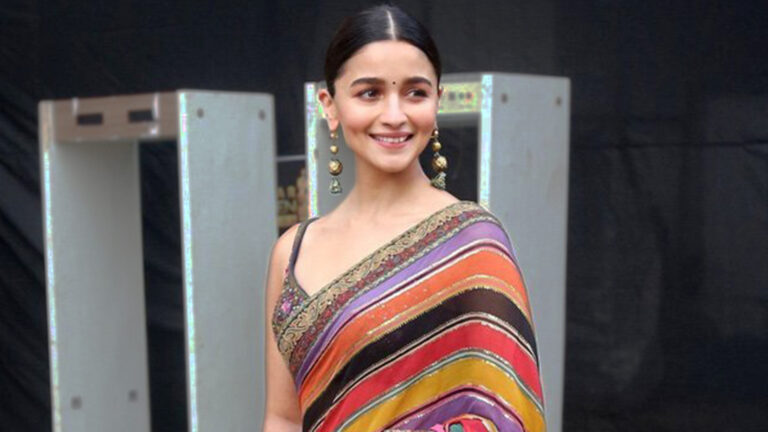 You can also style this blouse design styled by Alia Bhatt with a saree